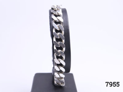 1970s solid sterling silver curb chain bracelet. Hallmarked 925 for sterling silver Main photo of bracelet displayed on a stand looking straight on