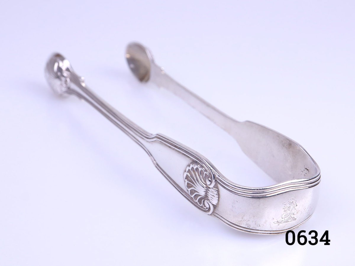 c1843 Fiddle thread shell tongs by George Adams. Fully hallmarked Photo showing tongs with the arched handle end in the foreground