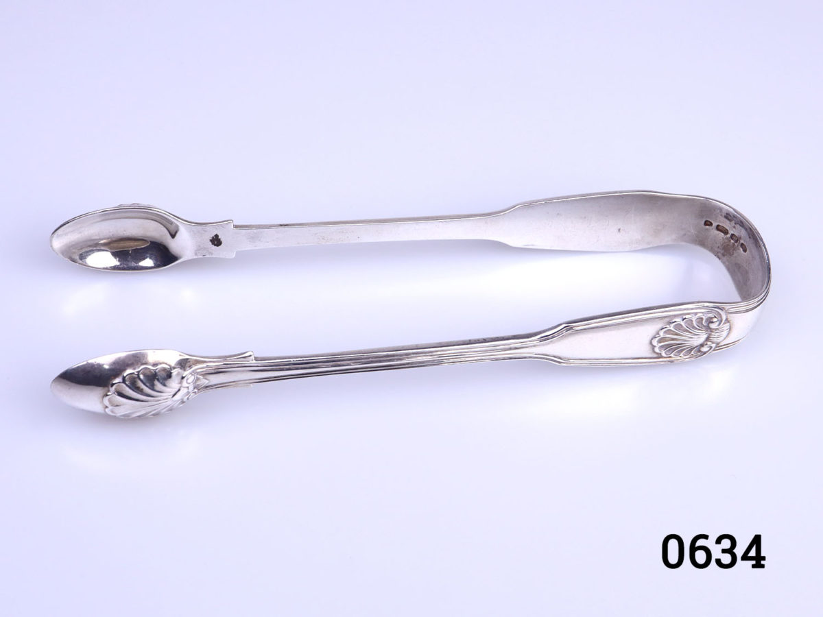c1843 Fiddle thread shell tongs by George Adams. Fully hallmarked Photo of tongs seen with spoon ends on the left