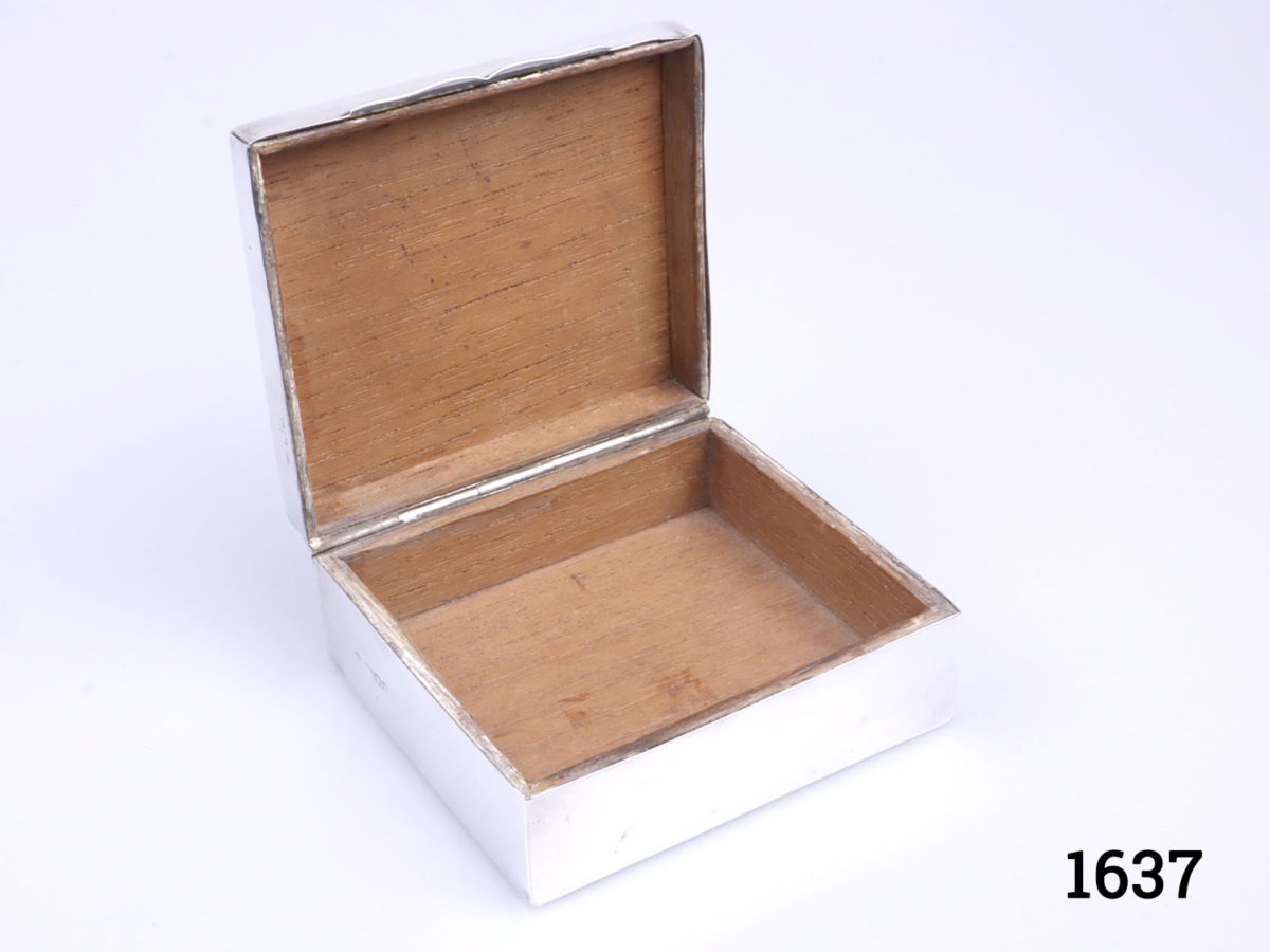 c1905 London assayed sterling silver covered box by W.M.Comyns. Fully hallmarked to the side of the box. A few small dents around the box. Photo of box with lid open showing wooden interior