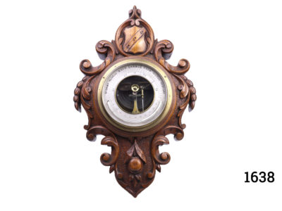Small antique Victorian barometer and thermometer. Intricately carved solid oak with shield crest at the top. Fully serviced and guaranteed for 1 year from date of purchase. Main photo showing whole barometer from front on