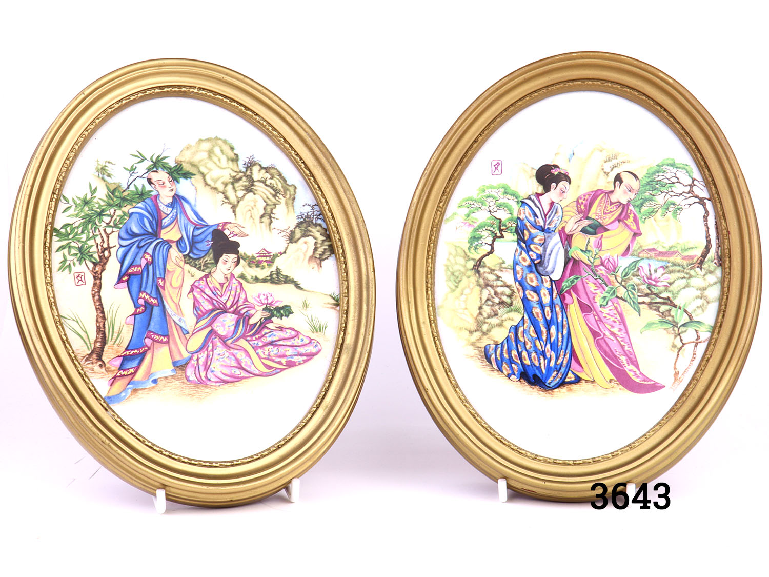 Pair of vintage oval gilt framed Oriental porcelain pictures. Hand-painted with scenes of courting couples in an Oriental setting. Felt peeling at back. Main photo showing both pictures sside by side displayed on stands