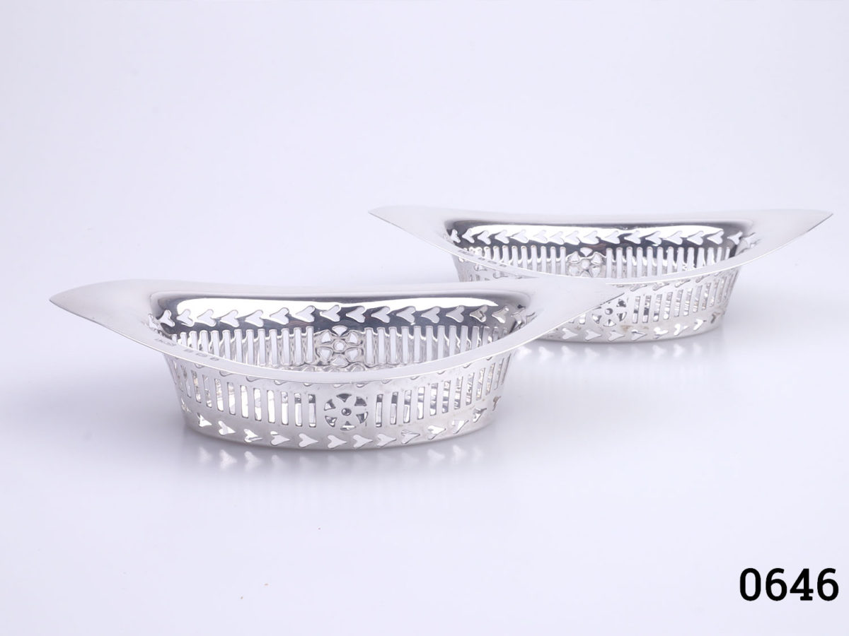 c1910 Birmingham assayed sterling silver dishes. 2 eye shaped dishes with oval interior and lattice work around the edges. Each dish measures 135mm long, 75mm at widest point, 35mm tall at tallest end points & 25mm tall in middle. Main photo both dishes side by side one in front of other seen sideways long