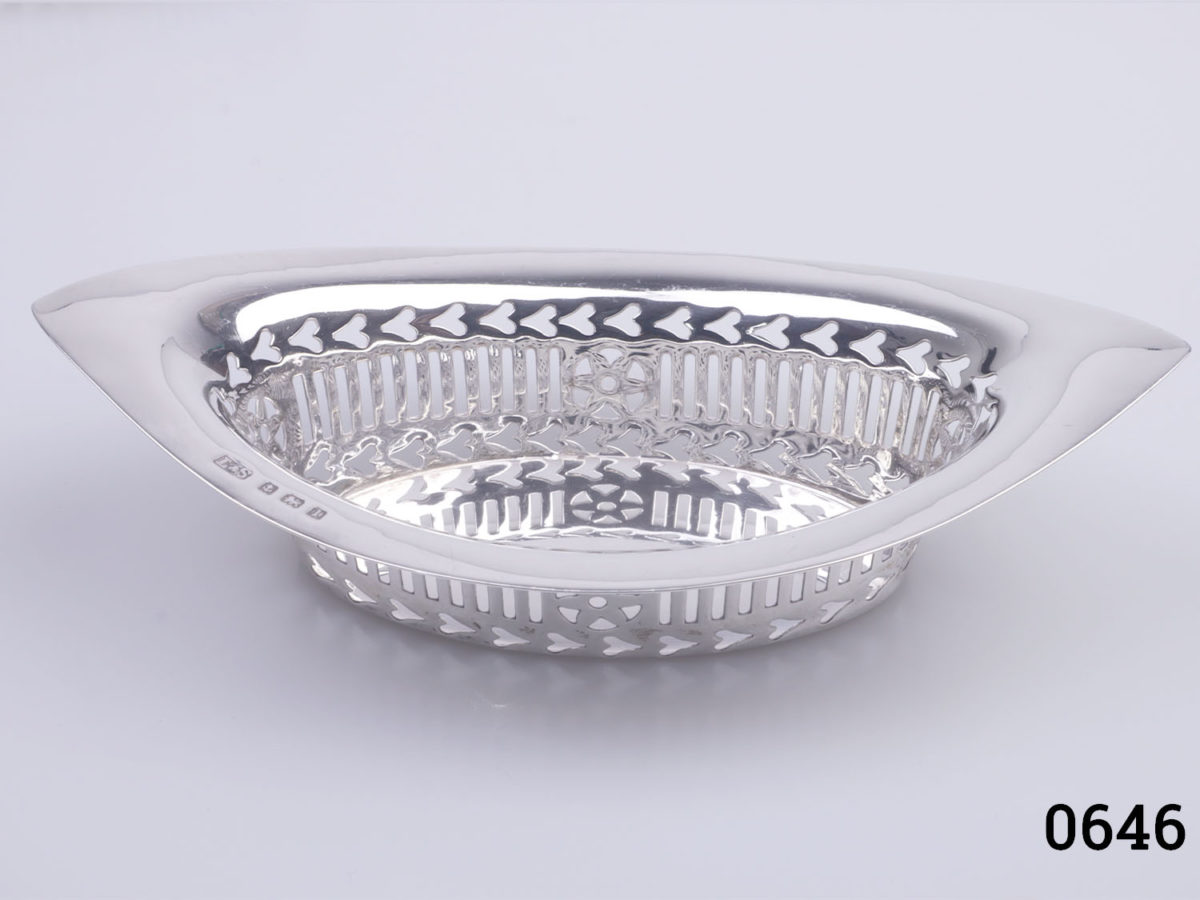 c1910 Birmingham assayed sterling silver dishes. 2 eye shaped dishes with oval interior and lattice work around the edges. Each dish measures 135mm long, 75mm at widest point, 35mm tall at tallest end points & 25mm tall in middle. Photo of single dish seen lengthways from the side