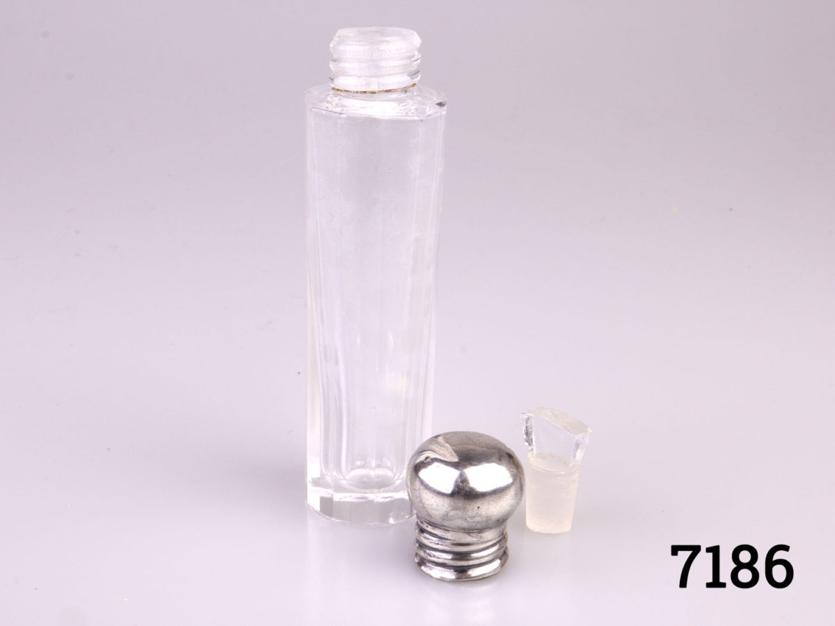 c1913 Birmingham assayed sterling silver screw-top lidded scent bottle. Fully hallmarked to side of the lid and made by Henry Clifford Davis. Measures 20mm in diameter at base Photo of bottle with lid and stopper removed and placed to the side of bottle