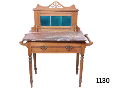 Small Victorian washstand in oak with marble top, towel rails to either side and plain green tiles on the splash back Measures 1020mm from towel rail to towel rail Height to work surface 750mm and surface depth 465mm. Legs measure 690mm by 385mm Main photo of washstand seen from the front