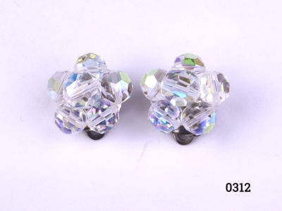 Vintage clip-on earrings with crystal glass beads Clips in good working order No makers mark Measures 20mm in diameter Main photo showing earrings from front view