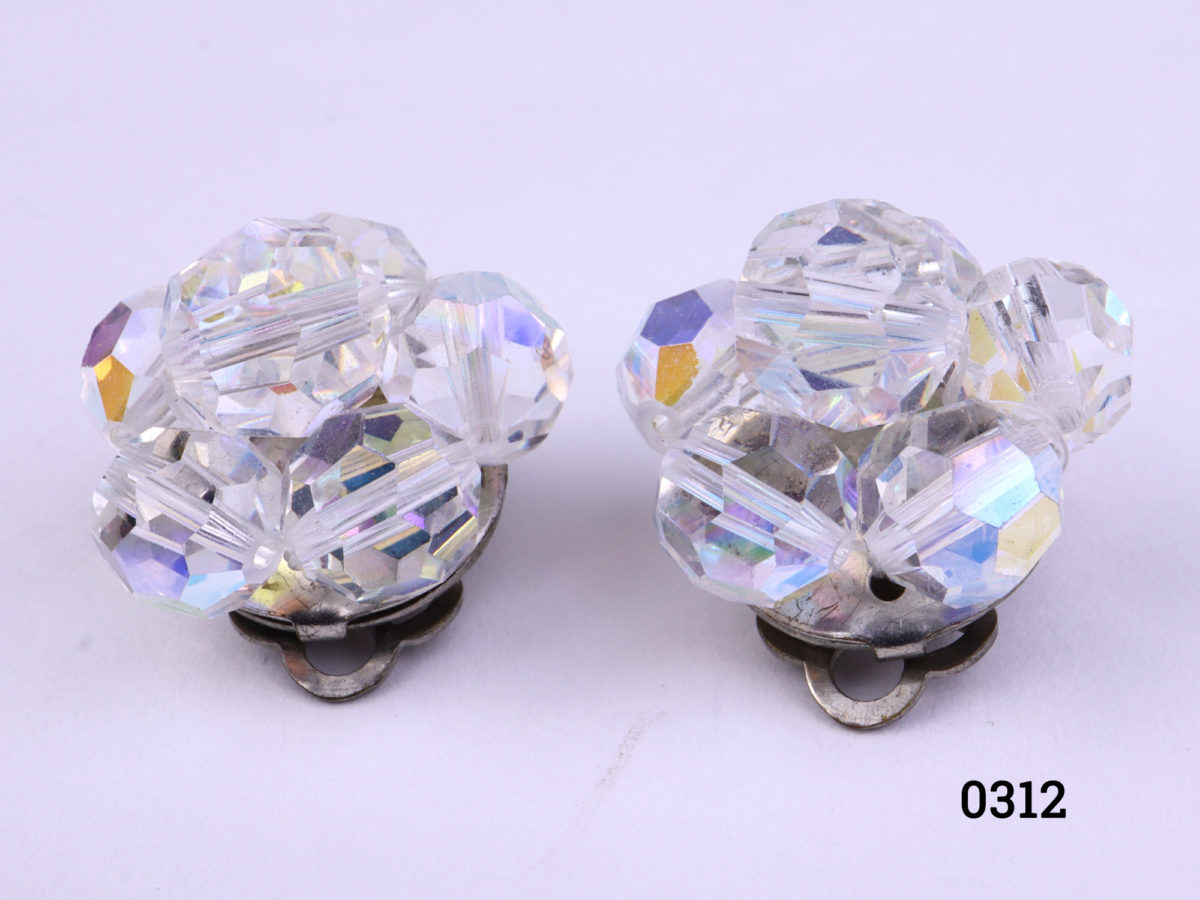 Vintage clip-on earrings with crystal glass beads Clips in good working order No makers mark Measures 20mm in diameter Close up photo of the front of earrings