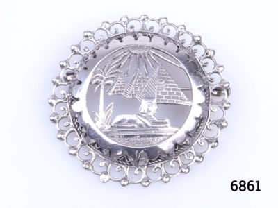 Vintage Egyptian 800 grade silver brooch. Egyptian revival piece decorated with scene of Pyramids & Sphinx. Measures 46mm in diameter Main photo showing front of brooch with full on straight view of Pyramids & Sphynx