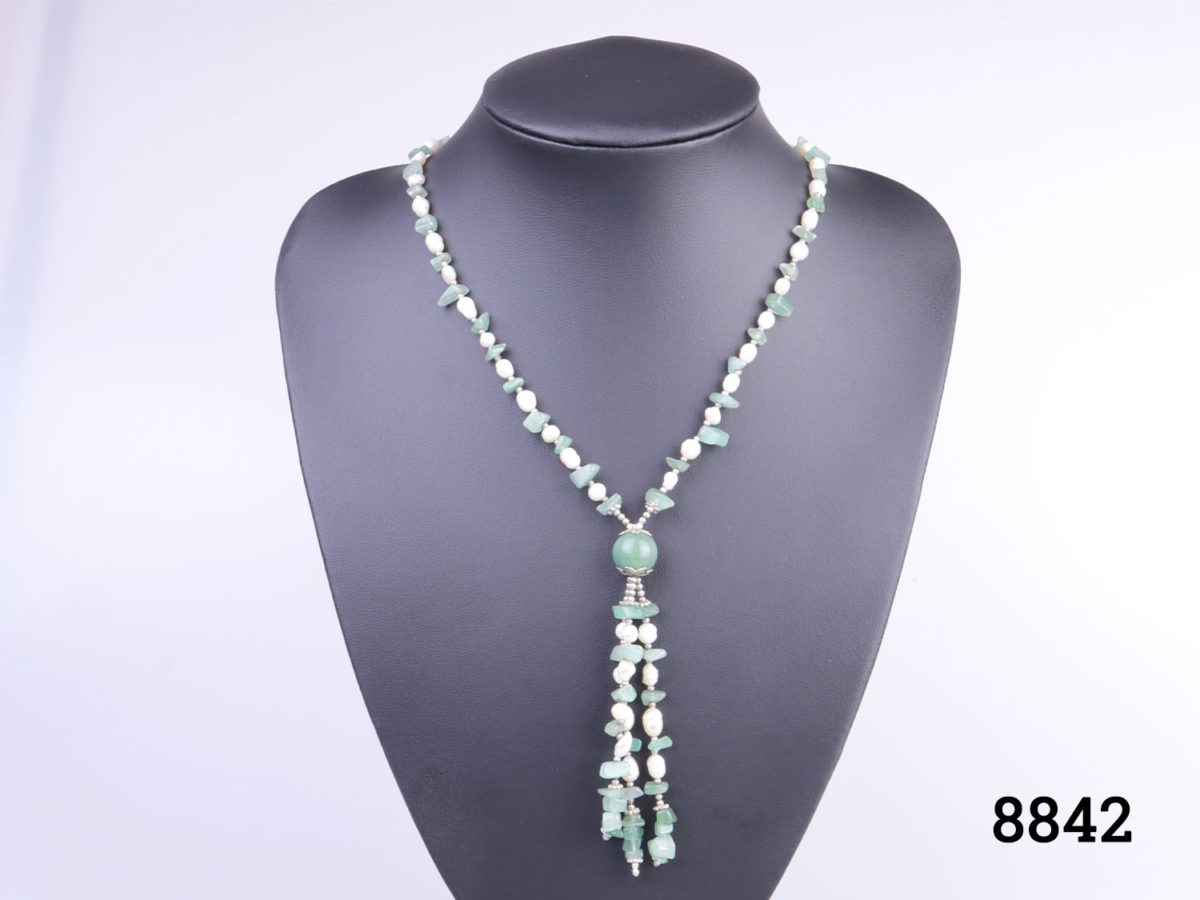 Vintage freshwater pearl and aventurine beads necklace with tassel pendant. Tassel drop length 90mm Main photo showing necklace displayed on a stand