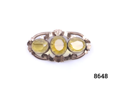 Vintage Pinchbeck brooch with 3 oval cut yellow glass beads. (Some scratching and minor chips to stones) Main photo of front of brooch