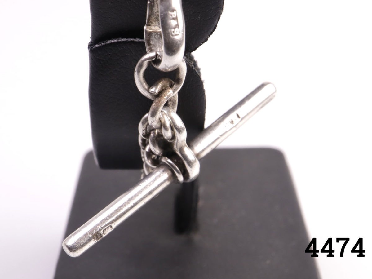 Vintage short sterling silver Albert pocket watch chain. Lion passant mark on each link. Photo of hallmark on lobster clasp and bar