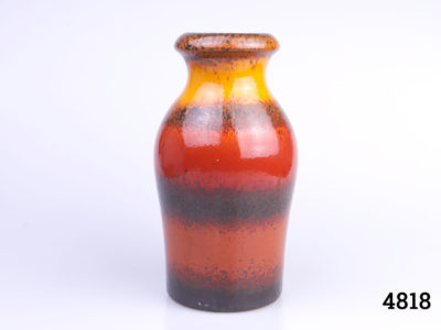 Mid 20th Century West German lava vase by Scheurich Keramik in hues of tequila sunrise over brown. Makers mark and serial number to base. Measures 80mm in diameter at base and 70mm in diameter across top. Main photo showing whole vase