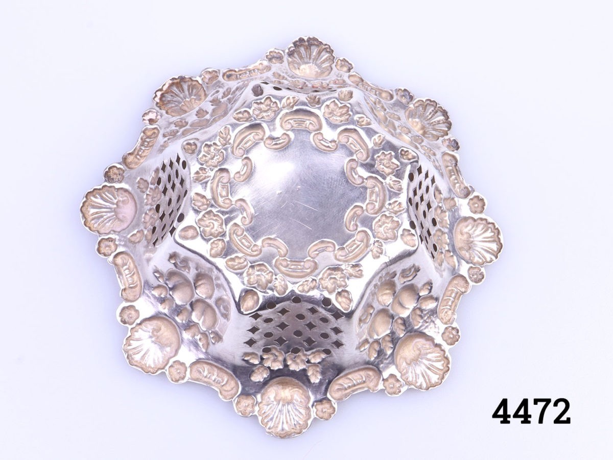c1906 Birmingham assayed small sterling silver bonbon dish. Highly decorated with shells and pierced work. Measures 50mm in diameter at base and 90mm in diameter at top Photo of back of dish