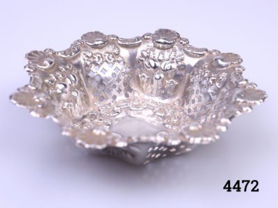 c1906 Birmingham assayed small sterling silver bonbon dish. Highly decorated with shells and pierced work. Measures 50mm in diameter at base and 90mm in diameter at top Main photo showing dish from a slightly raised eye level