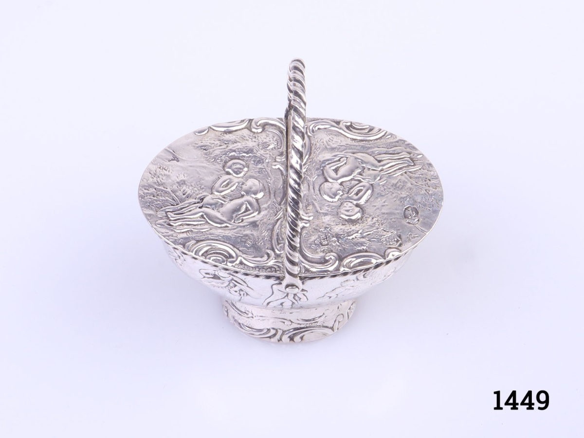 c1900 Dutch novelty silver snuff box in the form of a basket. Central hinged lid that opens both sides. Dutch hallmarks to the lid. Photo of box from a raised angle with handle up
