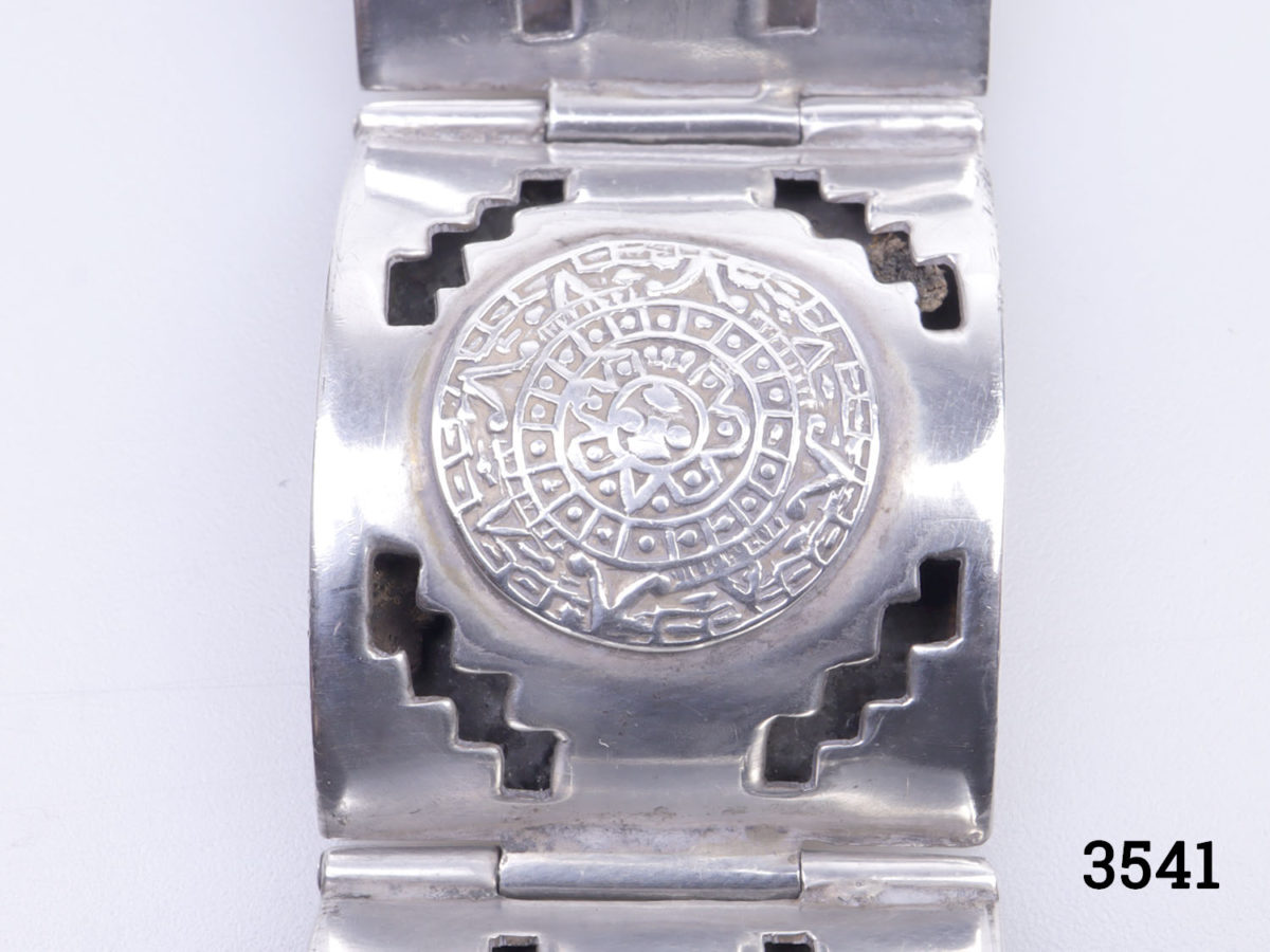 Vintage signed Mexican sterling silver bracelet. Chunky panel bracelet with Mayan calendar design to each panel. Fully hallmarked. Close up photo of the Mayan calendar on one of the panels