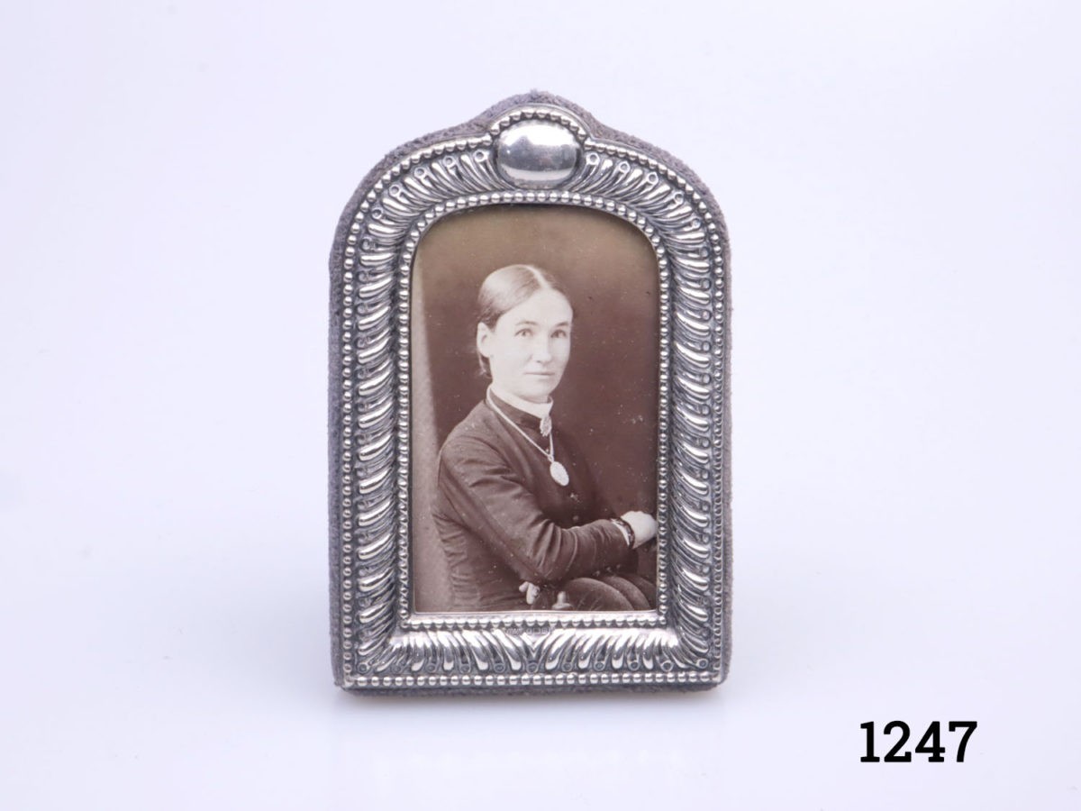 c1988 vintage Mappin & Webb sterling silver photo frame. Small arch shaped frame with blank cartouche at the top for personalising . Fully hallmarked to the bottom centre of the frame. Main photo showing upright frame from the front
