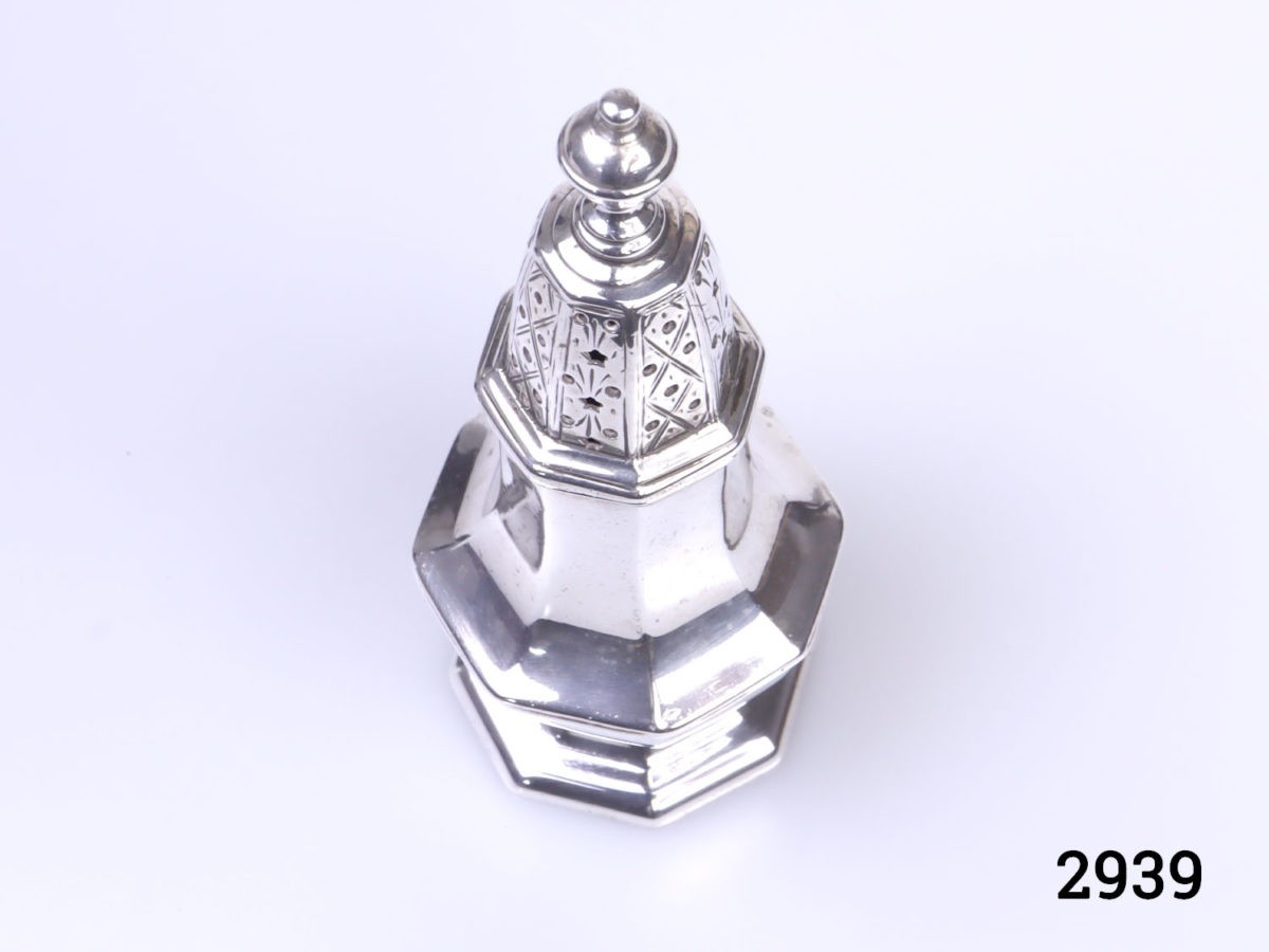 c1913 London assayed sterling silver small sugar sifter. Fully hallmarked on outer rim of sifter base and inside rim of top. Measures 40mm in diameter at base Photo of sifter with lid in place and seen from a raised angle
