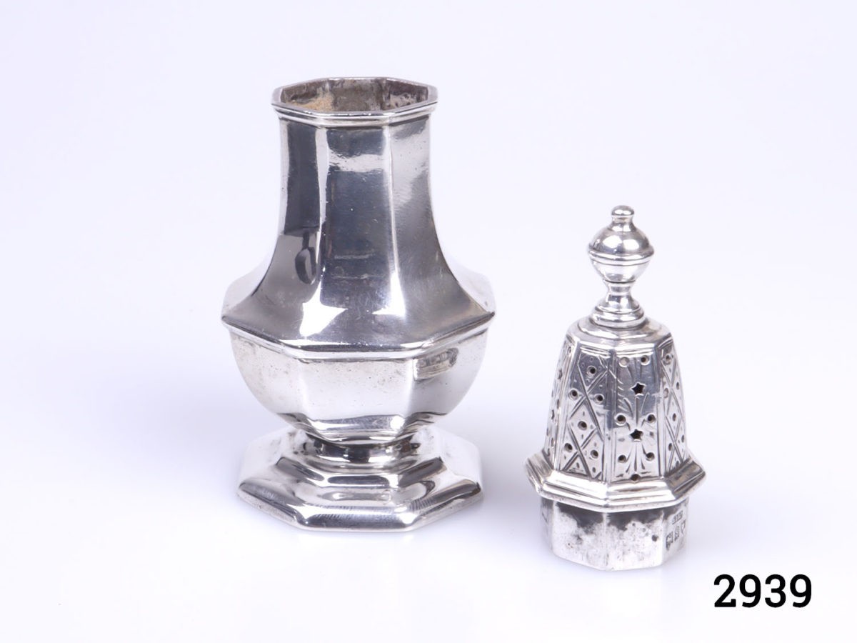 c1913 London assayed sterling silver small sugar sifter. Fully hallmarked on outer rim of sifter base and inside rim of top. Measures 40mm in diameter at base Photo of sifter with lid removed and placed to the right of the bottom half