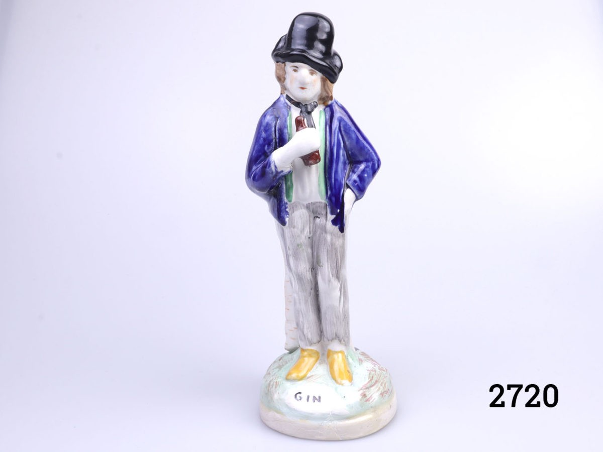 Vintage 2 sided Staffordshire Pottery figure. Water to one side, smartly dressed in bright colours with a happy smiling face and gin side looking dishevelled in grey and confused face. Photo of the full figure of the dishevelled gin drinker Photo of the base with no makers mark. Small hairline crack and chip to base visible