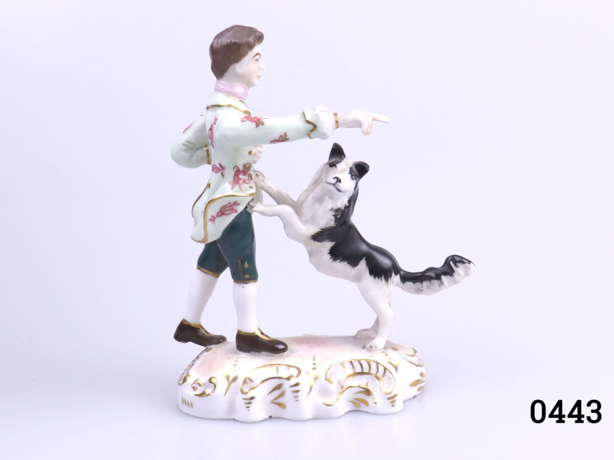 Royal Crown Derby figurine of The Shepherd by Edward Drew. Fully marked to the base. Figure in excellent condition. Photo of figurine sideways on with Shepherd facing & pointing straight right and the collie dog facing the camera