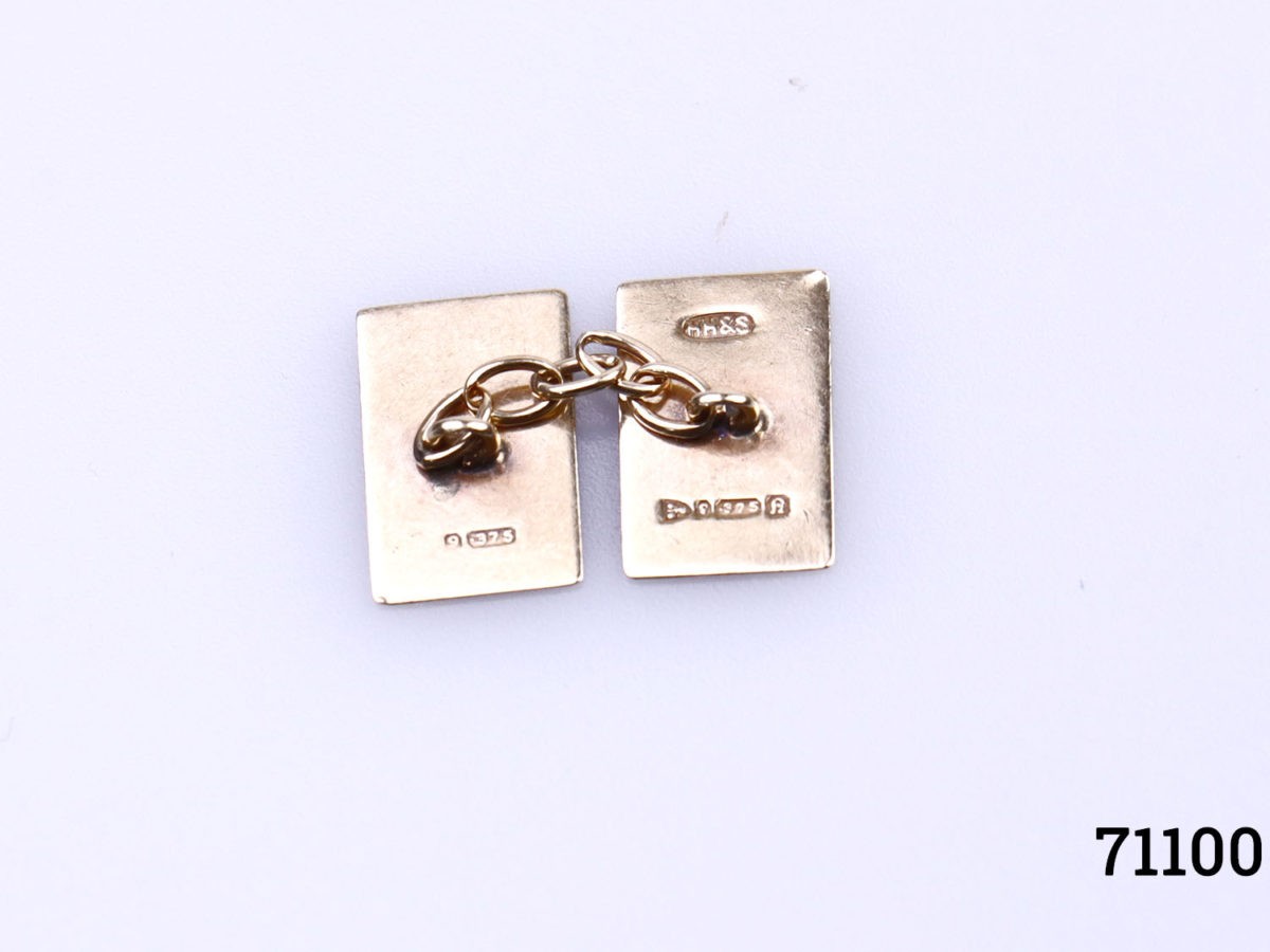 Vintage 9 karat gold cufflinks. Engine turned design on each rectangular end. Each rectangular end measures 15mm by 10mm with 25mm in length. Photo of the hallmarks on inside of each cufflink