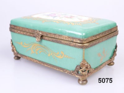 19th Century Paris porcelain box. Hand-painted box in sea green with floral design to centre of the lid with ormolou gilt metal edging and brass feet. Hand-painted picture signed by Renan Main photo showing box laid diagonally with one front corner in the foreground and with hand-painted picture on top of lid slightly visible
