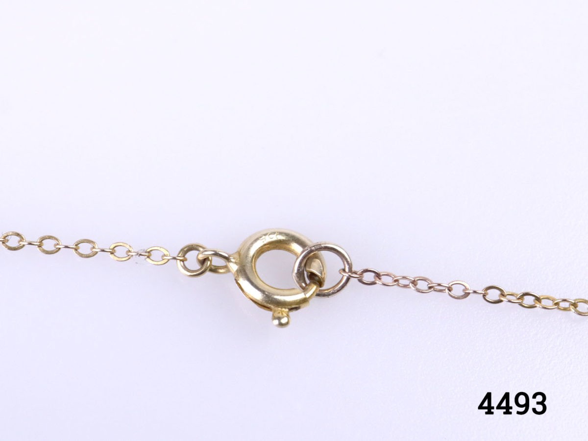 Vintage 9 karat gold necklace and heart pendant. Fine chain necklace with a small scrollwork 9 karat gold heart pendant (not locket) Hallmarked to both pendant & chain. Necklace length 410mm. Pendant drop length15mm from top of bail and 10mm wide at widest point. Necklace & pendant weight 1.4 grams Close up photo of the clasp