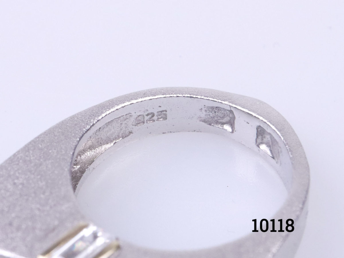 Chunky Modernist style sterling silver ring set with pearl to the centre and cubic zirconia to the sides below the pearl. Ring size P / 7.5. Ring weight 11.9 Close up photo of the 925 hallmark on the inner band of the ring