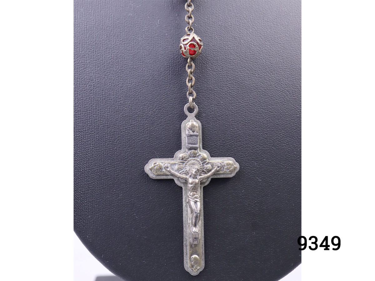 Vintage Italian rosary beads and crucifix. Long rosary beads with metal covered red glass beads and crucifix with Roma impressed in the back. Crucifix measures 55mm long by 32mm at widest point Close up photo of the front of crucifix