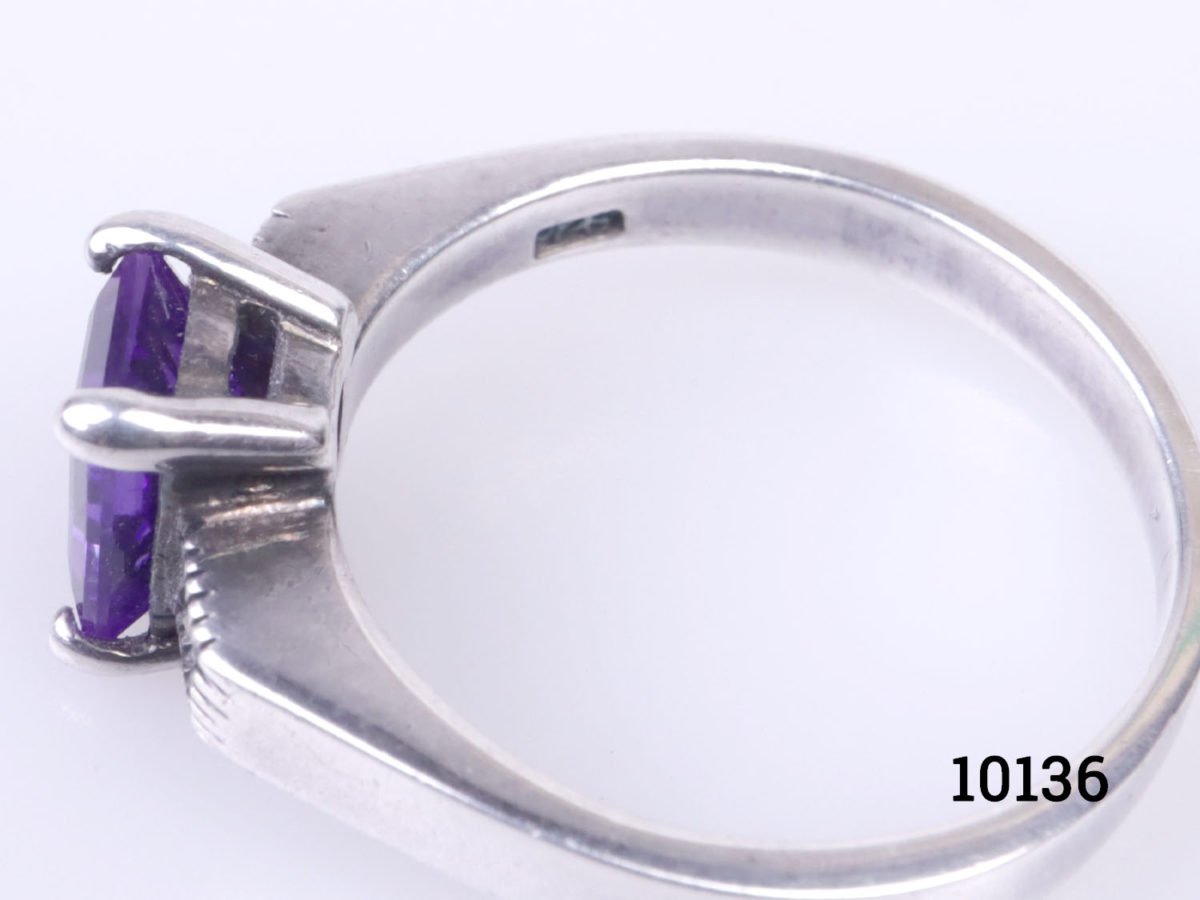 Vintage 925 sterling silver ring set with rectangle cut amethyst coloured purple crystal to the centre. Ring size P / 7.5 Close up of the 925 hallmark on the inside band of the ring