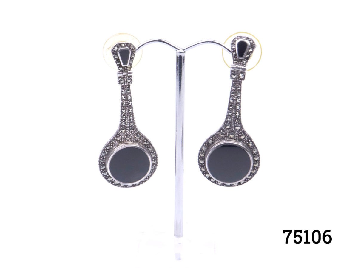 1980s Art Deco style earrings with jet & marcasite on silver. Hallmarked 925 for sterling silver.  Comes with plastic fastening at back for security. Silver butterflies can also be provided if preferred. Will be mailed boxed. Earrings weigh 11 grams. Drop length 50mm. With at widest part of earring at bottom 20mm. Photo of earrings displayed on a stand