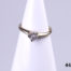 Vintage 9 karat gold ring with a small round cut diamond set on a white gold head.  Ring size M / 6. Ring weight 1.8 grams. Main photo of ring displayed on a stand and seen from the front.