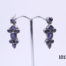 Vintage sterling silver earrings set with iolite stones. Various cuts of iolite stones set in 925 sterling silver. Hallmarked 925 to the back of earrings and butterflies. Each earring measures 36mm in drop length from top stud to base and 15mm at widest point.  Main photo showing both earrings displayed on a stand
