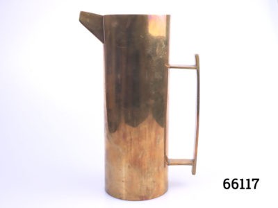 Vintage Art Deco style heavy copper jug. Tall copper jug with long handle and square spout. Nice aesthetic shape. Measures 80mm in diameter at base. Main photo of jug from an eye level angle with spout at the top left of photo and long handle to right