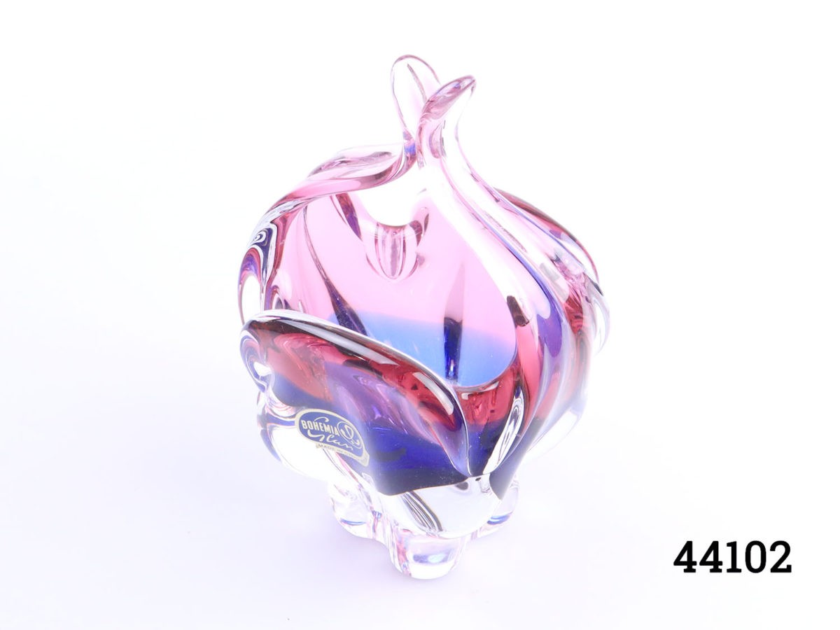 Vintage Bohemia glass basket in pink ruby and blue sapphire shade giving off a purple hue under different light Original label still attached. Base measures 45mm square. Photo of basket seen from a slightly raised and offside angle