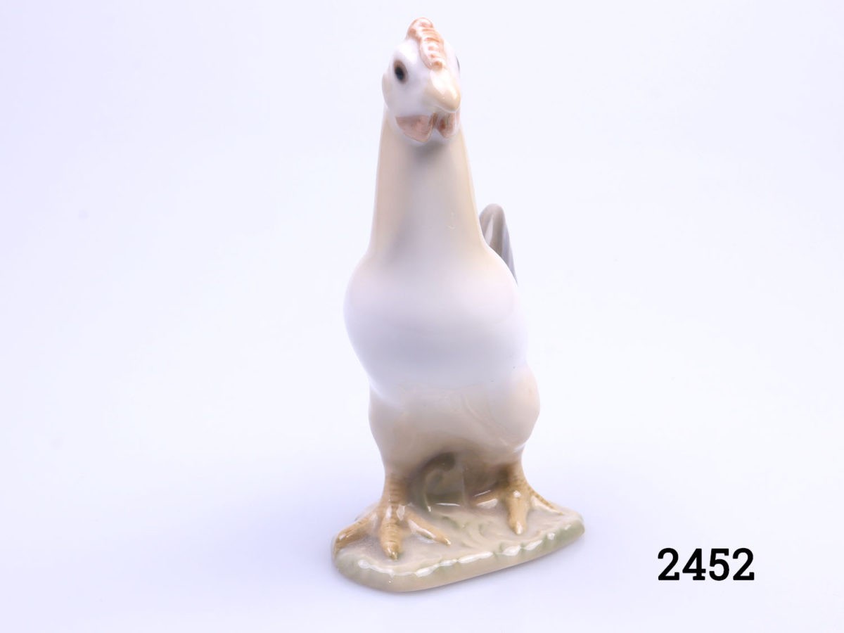 Vintage porcelain chicken made by Bing & Grondahl of Denmark. Small chicken ornament in earthy colours. Fully stamped to the base with the makers mark. Photo of chicken facing the camera