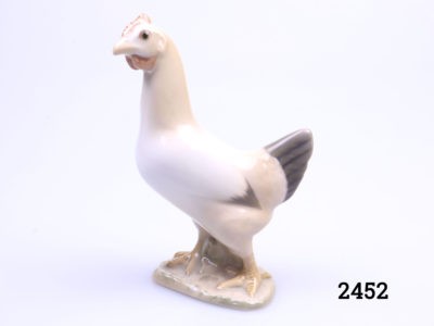 Vintage porcelain chicken made by Bing & Grondahl of Denmark. Small chicken ornament in earthy colours. Fully stamped to the base with the makers mark. Main photo of chicken seen from a side angle with head in top left corner of photo and tail to the right