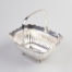 c1905 antique sterling silver bonbon dish. Nice size scallop edged bonbon dish on 4 ball feet with central handle. Height with handle fully extended is 125mm. Fully hallmarked for Sheffield assay. and made by Atkin Brothers Main photo of dish with handle up and hallmark to the right & centre of photo