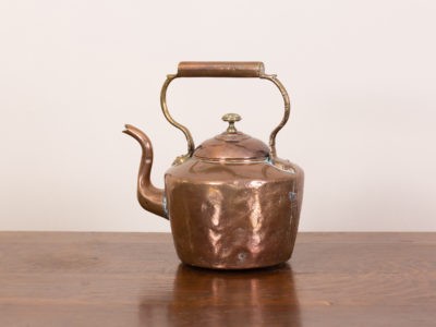 Vintage copper kettle. Well used battered old solid copper kettle with brass finial. Several points of repair visible and the base is uneven. This kettle has had a lot of usage ! Measures 163mm in diameter at base.