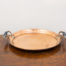Arts & Crafts copper tray. Solid copper medium sized tray with ornate bolted handles to the side. Measures 305mm in diameter at base and 25mm deep.