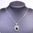 Vintage sterling silver box chain necklace with a sterling silver and black onyx pendant. Pendant drop length approximately 35mmand width 22mm Main photo of necklace displayed on a dark stand seen from the front