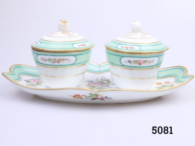Antique 19th century Paris porcelain double condiment pots on a tray. Identical sized lidded condiment containers attached to a decorative tray. Floral design with peppermint green and gilt. In excellent condition throughout with minor marks inside the pots only. Pots measure 82mm in diameter across the top. Main photo of both pots seen from an eye level angle