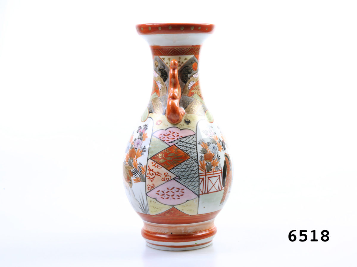 Antique Japanese Kutani vase. 2 handled Meiji period vase with Japanese figures to one side and birds on reverse side. c1868-1912 Measures 75mm in diameter at base Photo of vase from the side showing the intricate hand-painted pattern and handle