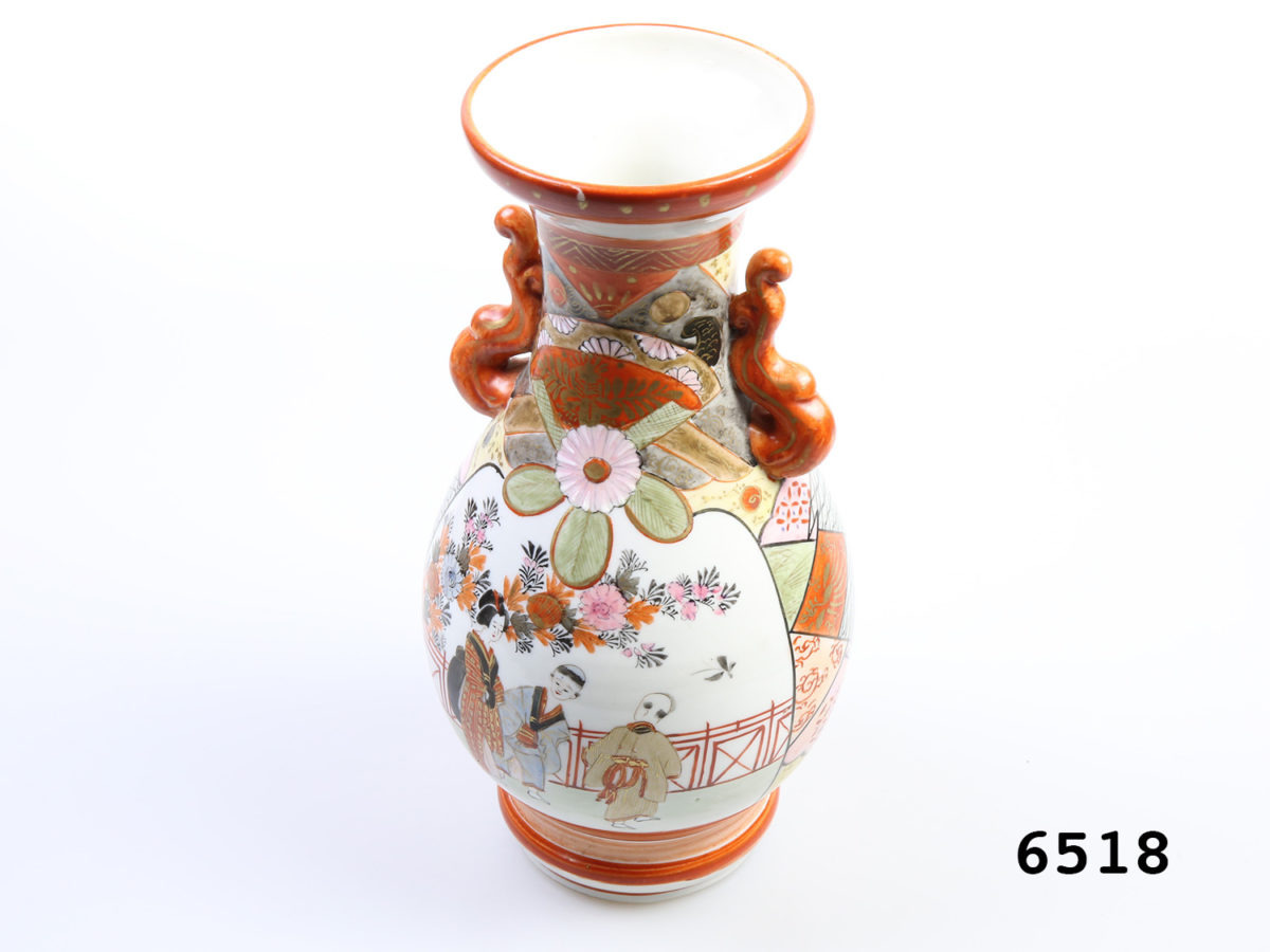 Antique Japanese Kutani vase. 2 handled Meiji period vase with Japanese figures to one side and birds on reverse side. c1868-1912 Measures 75mm in diameter at base Photo of vase from a slightly raised angle and slightly at an angle