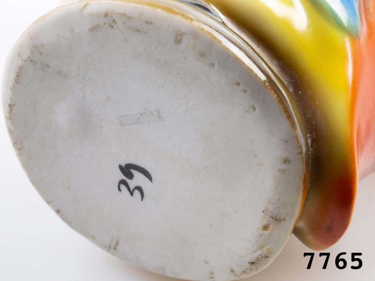 1940s vintage creamer jug in the form of a colourful Kingfisher bird. Colourful jug in the form of a toucan with beak as spout. Measures 62mm in diameter at base and 125mm at widest point from spout tip to handle edge. Photo of base of jug showing 'Foreign' stamp and number 39