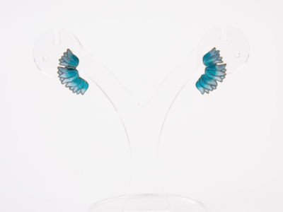 Vintage gilt silver earrings. Pair of gilt silver earrings in the form of wings with turquoise and light blue enamel. Hallmarked silver to the back. Earrings weigh 1.9grams and measure approximately 22mm long by 8mm wide. Main photo of both earrings displayed on a clear Perspex display stand