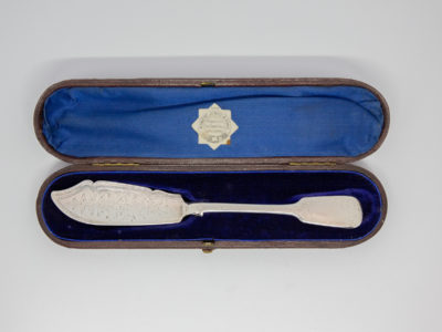 Antique cased sterling silver butter knife. c1872 ornate silver butter knife with a blank cartouche on the handle tip for personalisation. Presented in original case which has some minor signs of wear to the exterior. Made by Chawner & Co (George William Adams) Knife measures 195mm long and weighs 58.2grams Main photo of knife shown inside the fitted case.