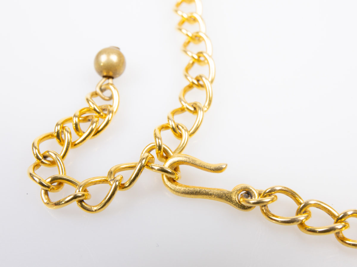 Vintage Kenneth Jay Lane collar necklace. Stunning gilt cut out collar necklace from the Safari range. Signed Kenneth Lane to the back. Slightly adjustable to maximum of 340mm Close up photo of the hook and chain clasp